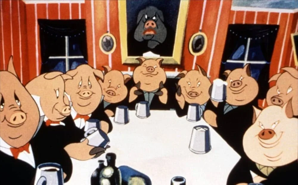 A group of cartoon pigs in tuxedos sit around a table with silver mugs, smiling and drinking. A framed portrait of a large…