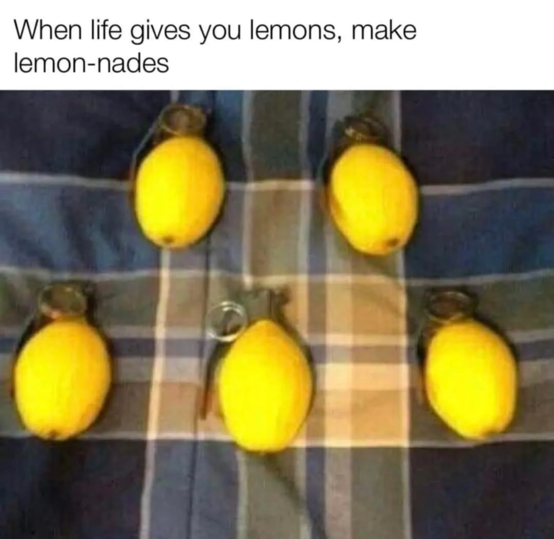 Five lemons are arranged on a plaid fabric, each with a grenade-style pull ring attached, visually parodying the phrase…