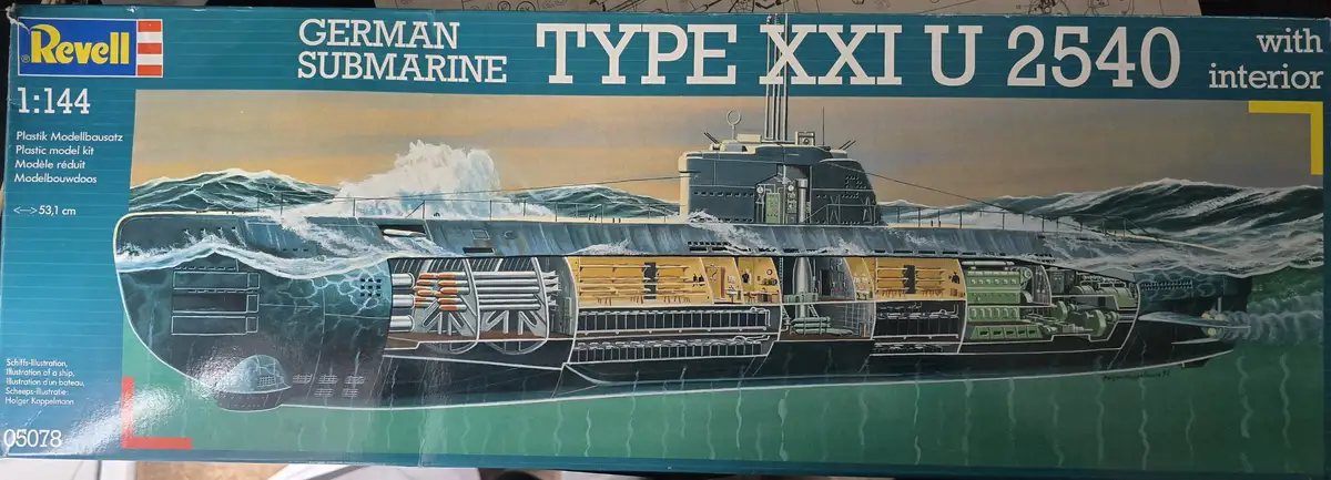 The image shows a Revell model kit box for a 1:144 scale German Type XXI U-2540 submarine, featuring a detailed…