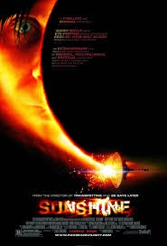 A movie poster for 'Sunshine' featuring a close-up of a person's face partially obscured by a fiery, glowing sun. The title…