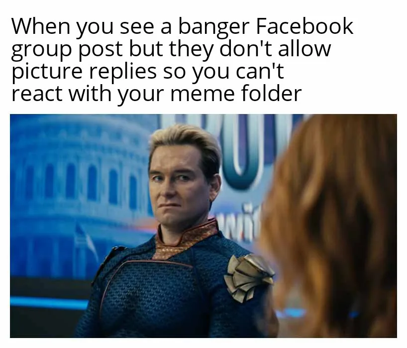 A man in a blue and gold superhero costume looks sideways with a disappointed expression at someone with red hair whose back…