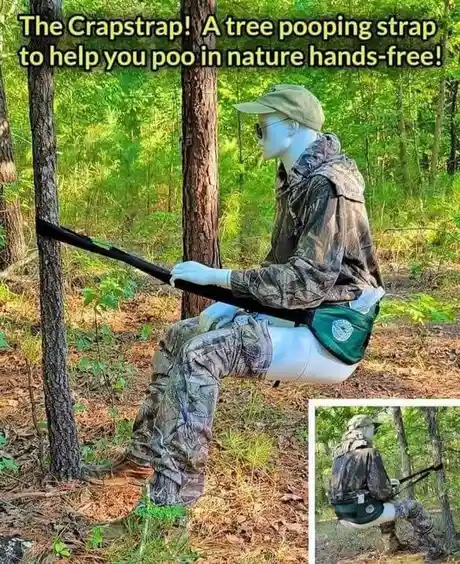A mannequin dressed in camouflage gear and a cap is seated outdoors between two trees, using a black strap that loops around…