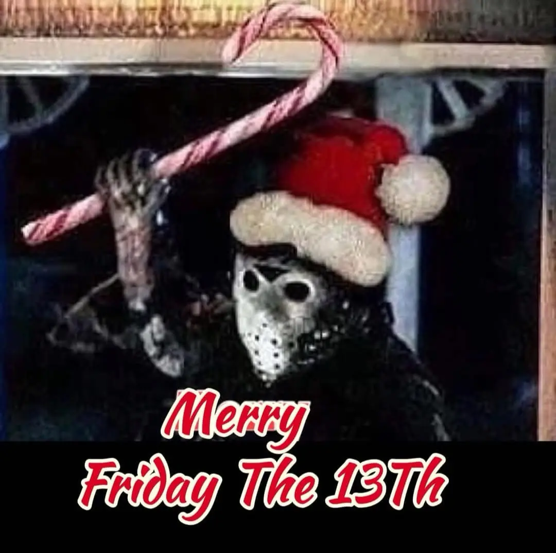 A person wearing a Jason Voorhees hockey mask and a red Santa hat holds a large candy cane like a weapon. The image has a…