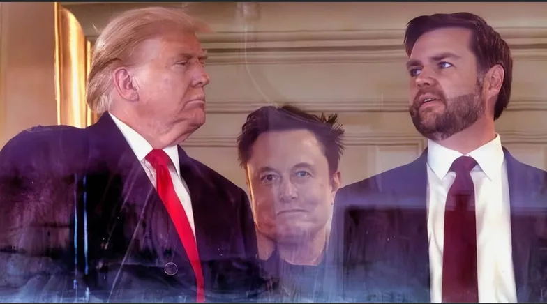 The image shows Donald Trump on the left and a man resembling James Corden on the right, both in suits and ties, looking at…