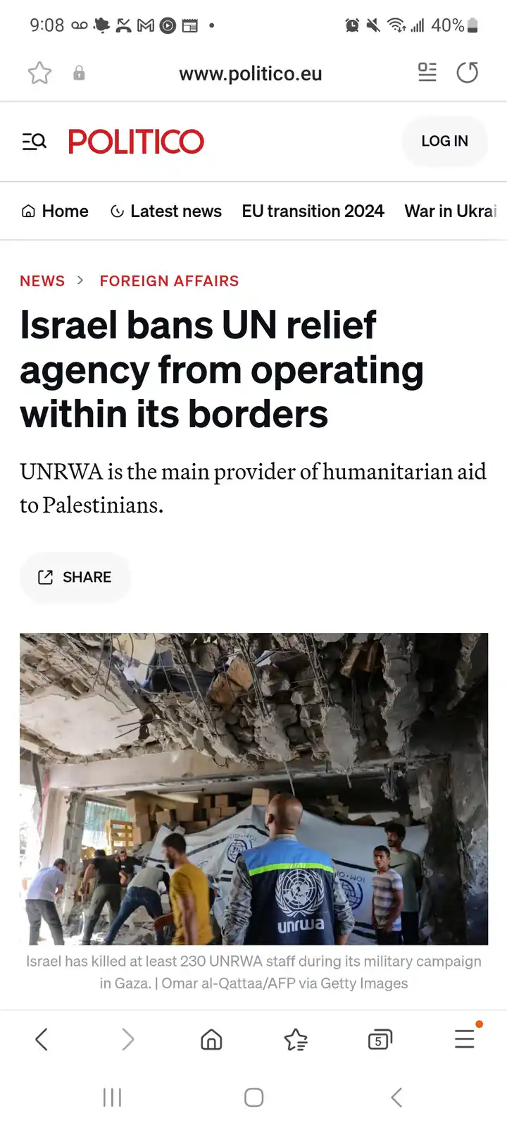 A screenshot of a Politico news article about Israel banning UNRWA, showing a photo of UNRWA workers in a destroyed…