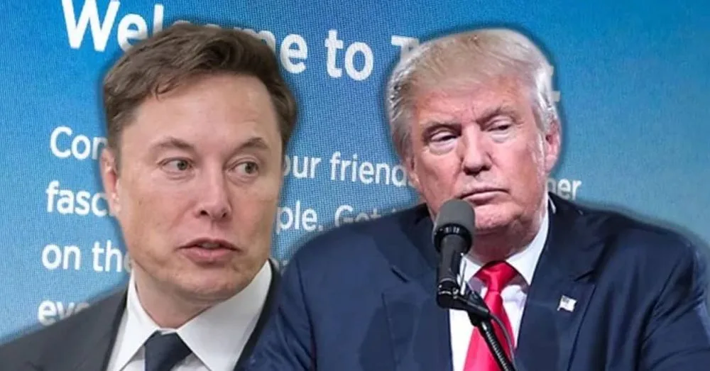 The image shows two men, Elon Musk on the left and Donald Trump on the right, seated side by side at a press event. Behind…