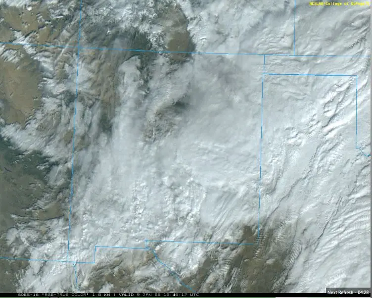 A satellite image shows a snowy mountainous region with blue grid lines outlining areas, overlaid with the text 'Next…