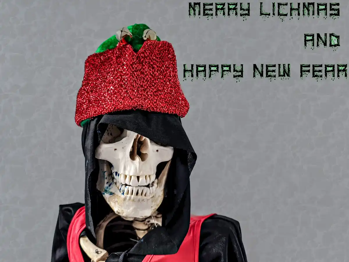 A skeletal figure wearing a black hooded robe with a red vest and a sparkly red hat shaped like a strawberry with green…