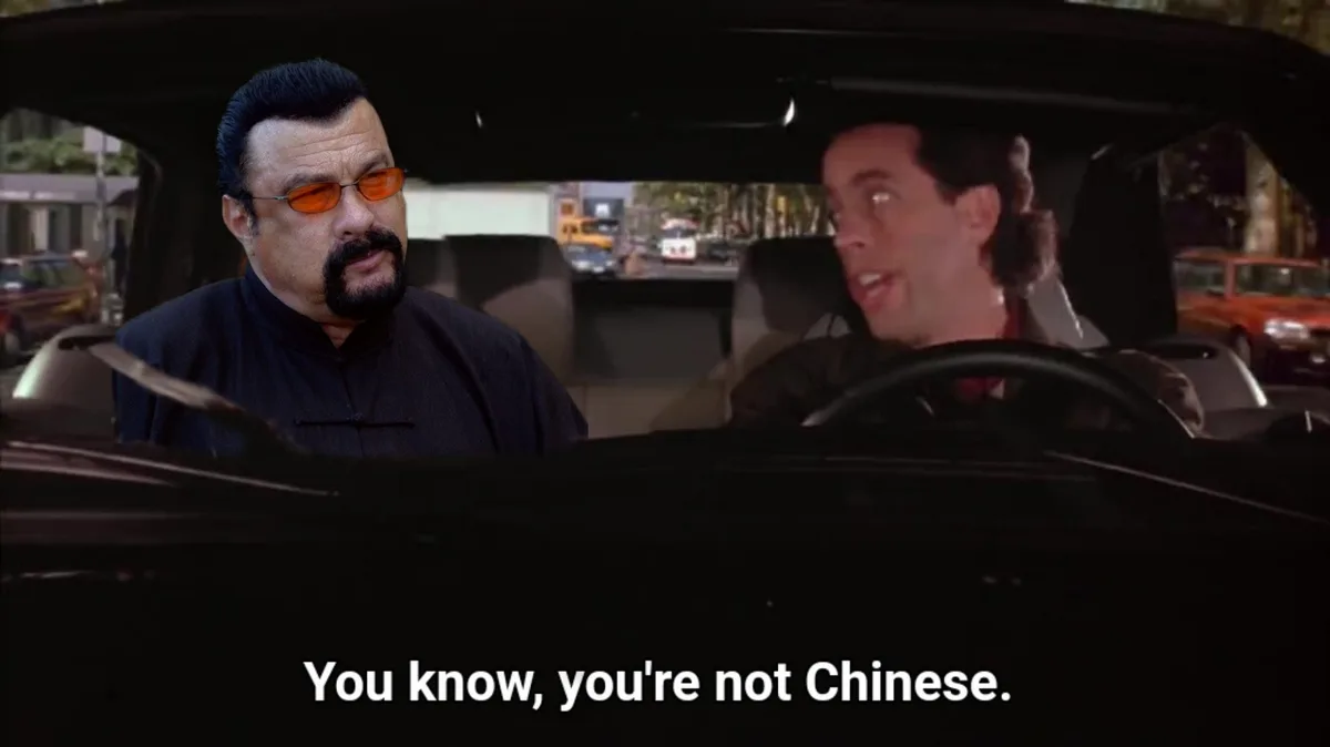 A still from the movie 'The Godfather Part III' shows a man with orange sunglasses and a black shirt sitting in the…