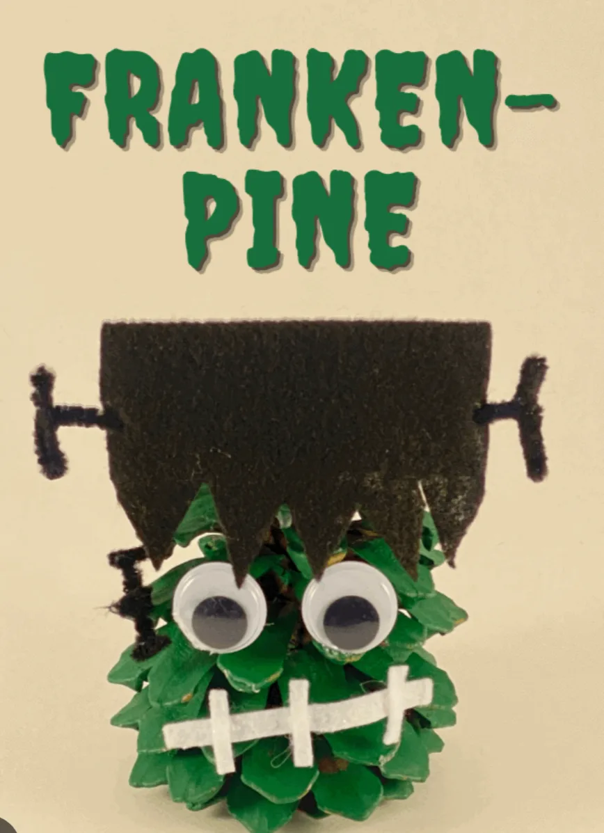 A handmade craft depicts a pinecone decorated to resemble Frankenstein's monster, featuring googly eyes, black felt hair…