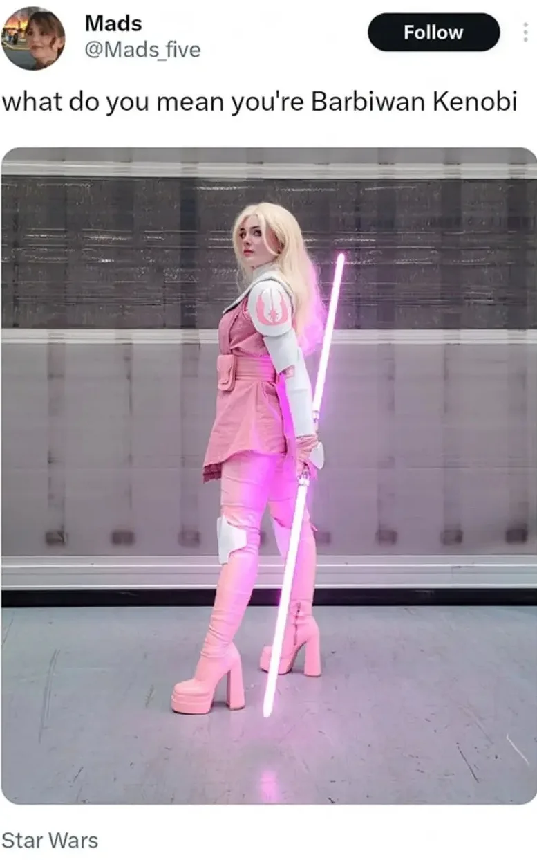 A person in a full-body pink and white Star Wars Jedi costume, complete with a pink lightsaber and platform heels, poses in…