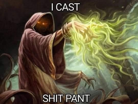 A hooded, robed figure with a glowing orange face casts a bright yellow-green magical spell from their outstretched hand…