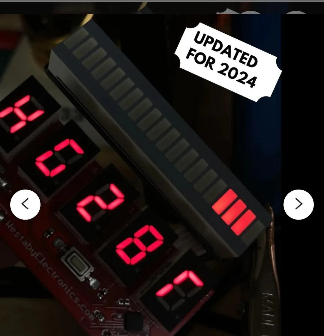 A close-up of a red circuit board with five red seven-segment LED displays showing the numbers 4, 0, 2, 8, and 7, arranged…