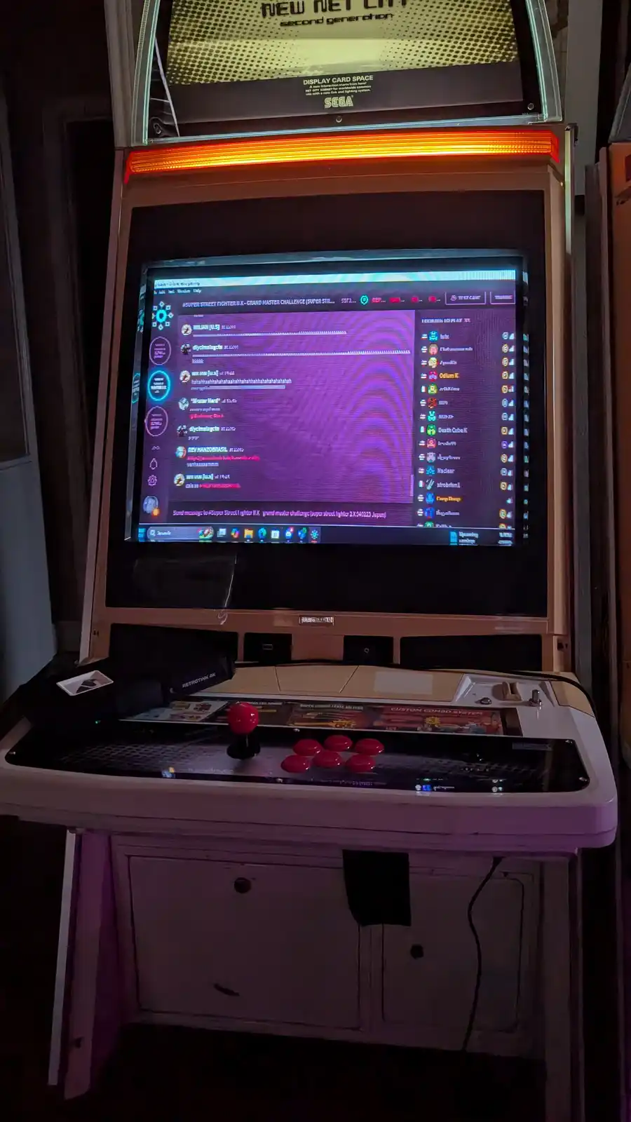 A vintage SEGA arcade cabinet, labeled 'NEW NET CITY second generation', displays a modern game interface for 'Super Street…