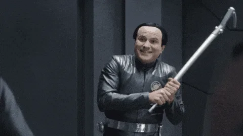 A still image of the character Grand Moff Tarkin from Star Wars, holding a staff-like weapon, is repeated in six panels. In…