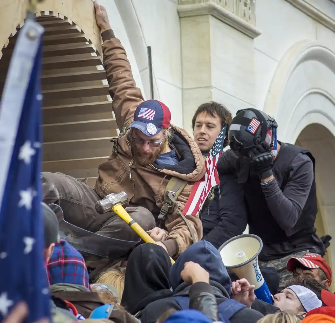Chaos Unleashed: Insurrectionists Hand Off a Sledgehammer on January 6th, 2021