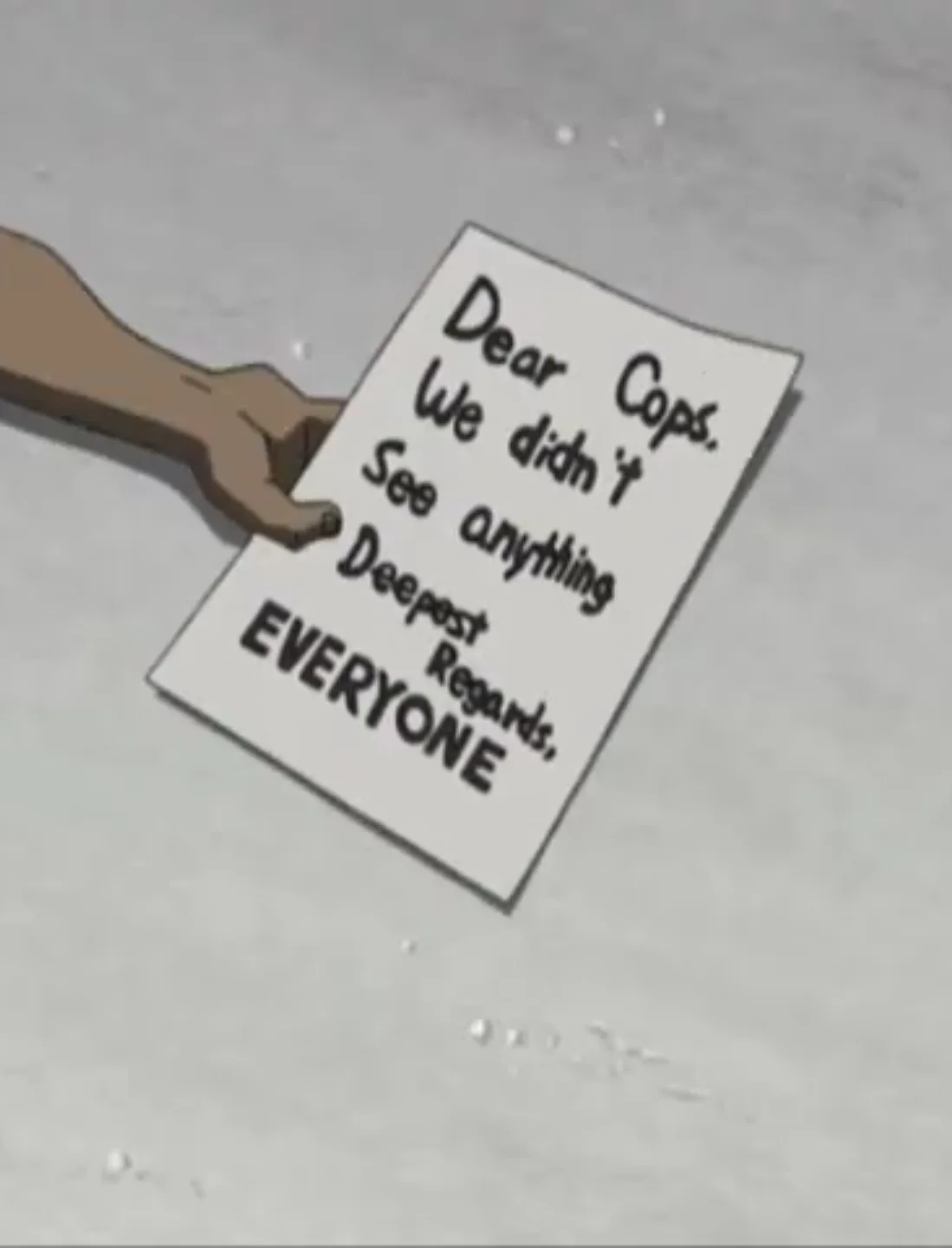 A hand holds a handwritten note on a white piece of paper against a gray, snowy background. The note reads 'Dear Cops. We…