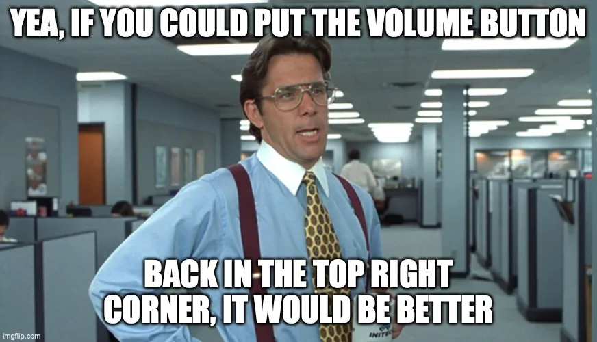 A man in a light blue shirt, patterned tie, and red suspenders stands in an office cubicle environment with fluorescent…