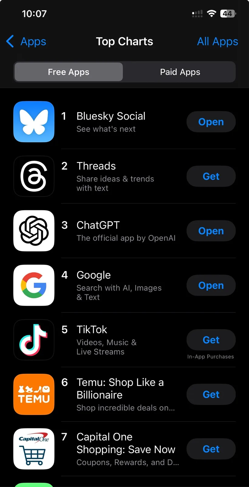 A screenshot of the Apple App Store's 'Top Charts' for 'Free Apps', showing Bluesky Social at #1, Threads at #2, ChatGPT at…