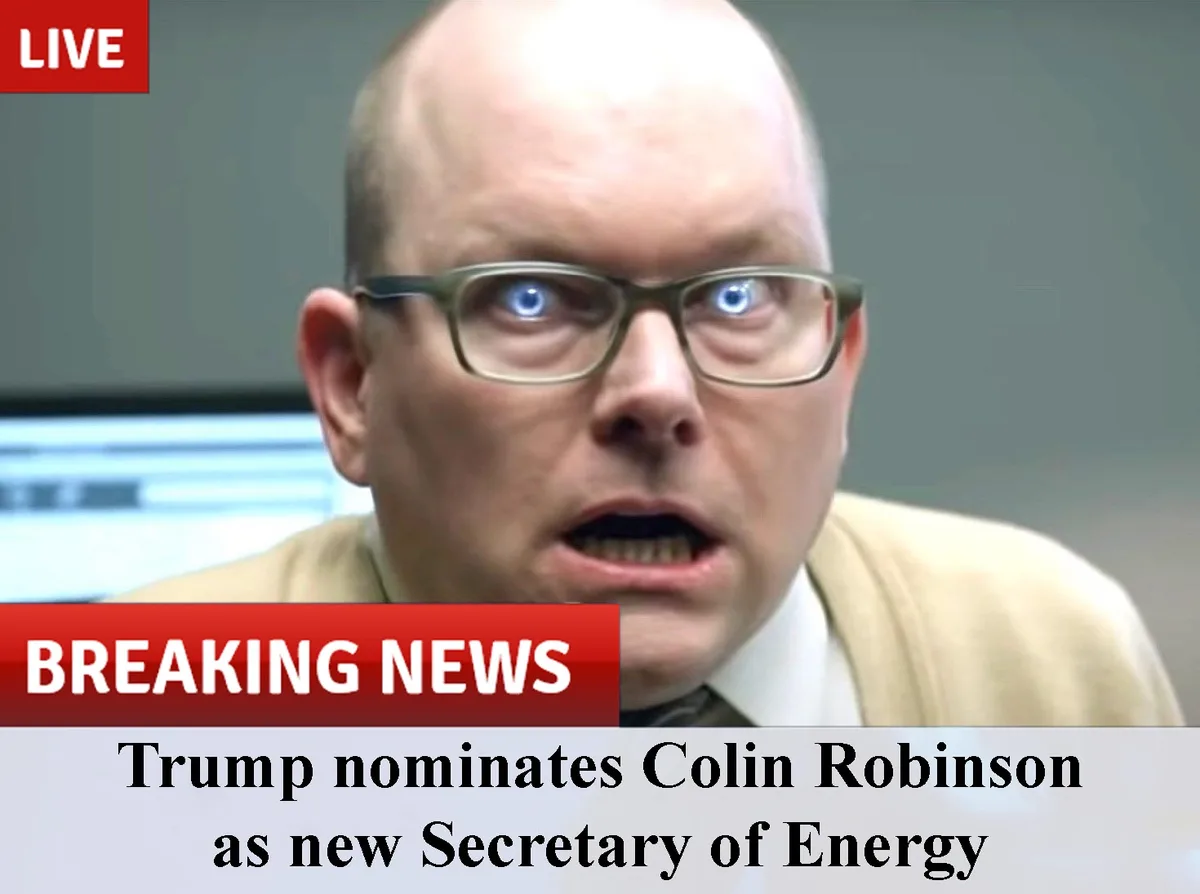 A man with glasses and a beige sweater has a shocked expression with wide eyes and an open mouth. The image is overlaid with…