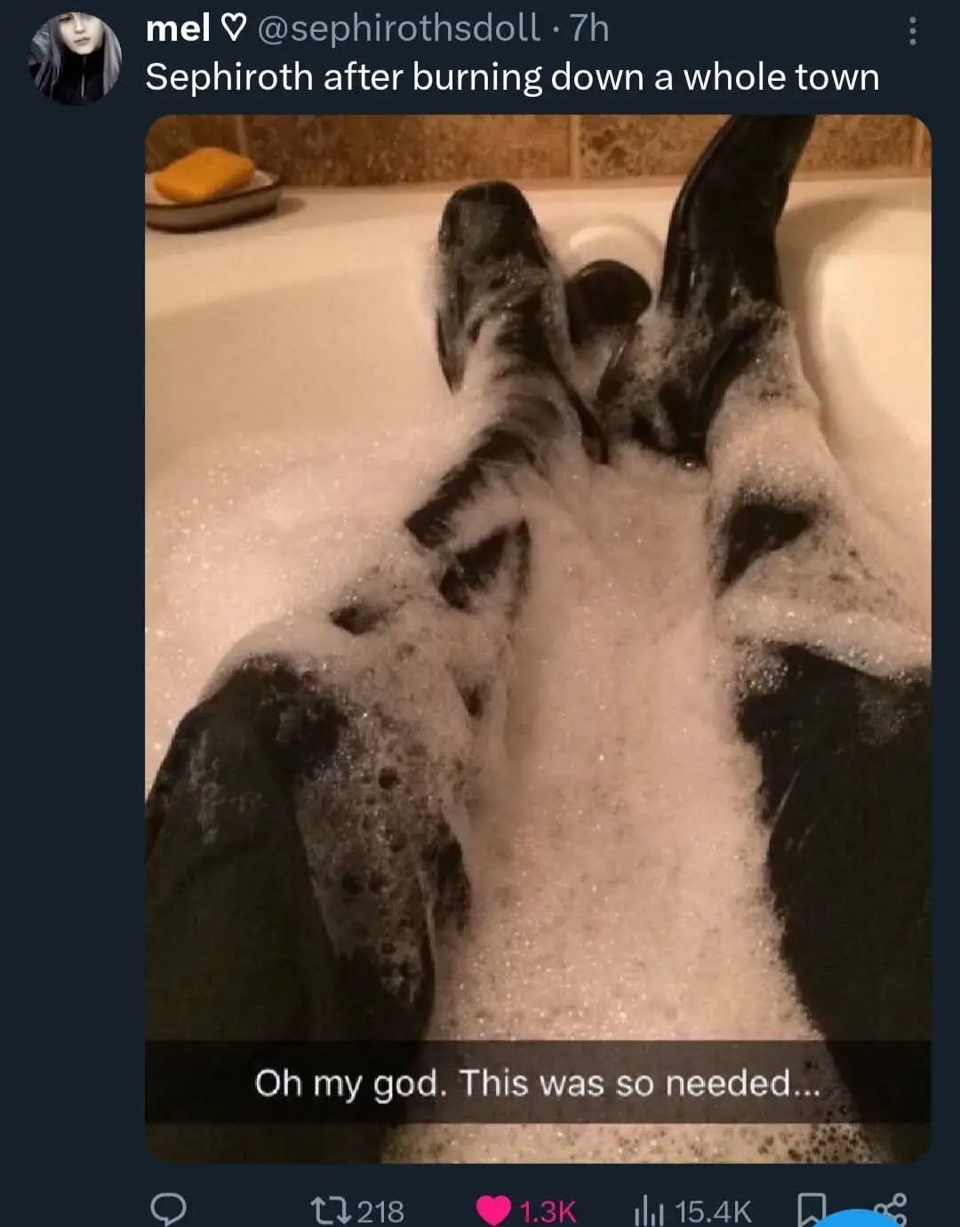 A person with dark hair is relaxing in a bubble bath, their legs and feet submerged in soapy water. The image is overlaid…