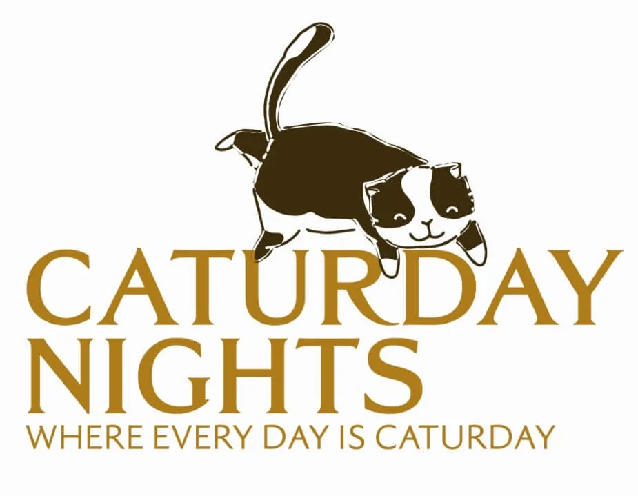 A stylized black and white cartoon cat is leaping joyfully above large gold text that reads 'CATURDAY NIGHTS' with a smaller…