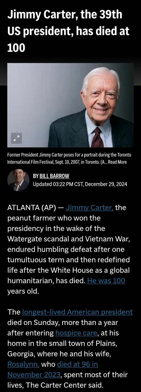 The image displays a news article screenshot announcing the death of former US President Jimmy Carter, with the headline…