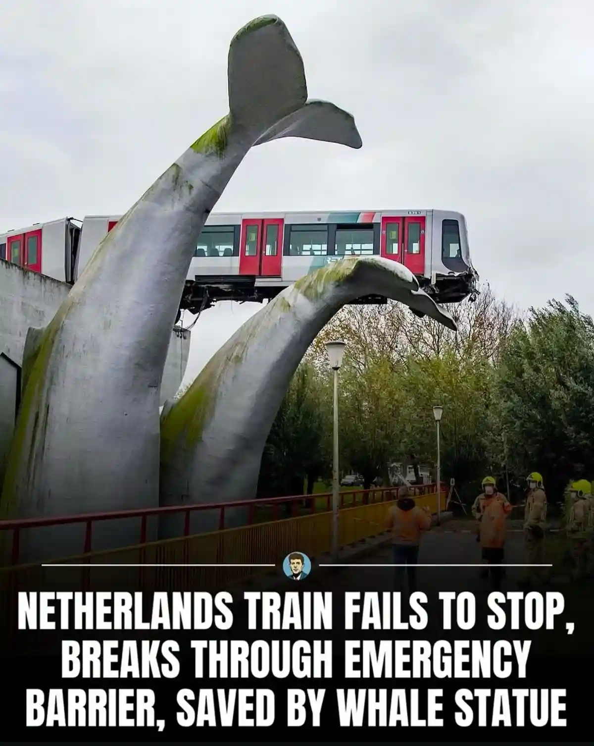 A train is shown crashing through a barrier and lodged between two large whale tail statues. Emergency personnel in orange…