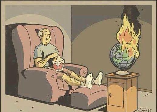 a man sits comfortably in a recliner, eating popcorn, while a globe on a stand beside him is engulfed in flames. The scene…