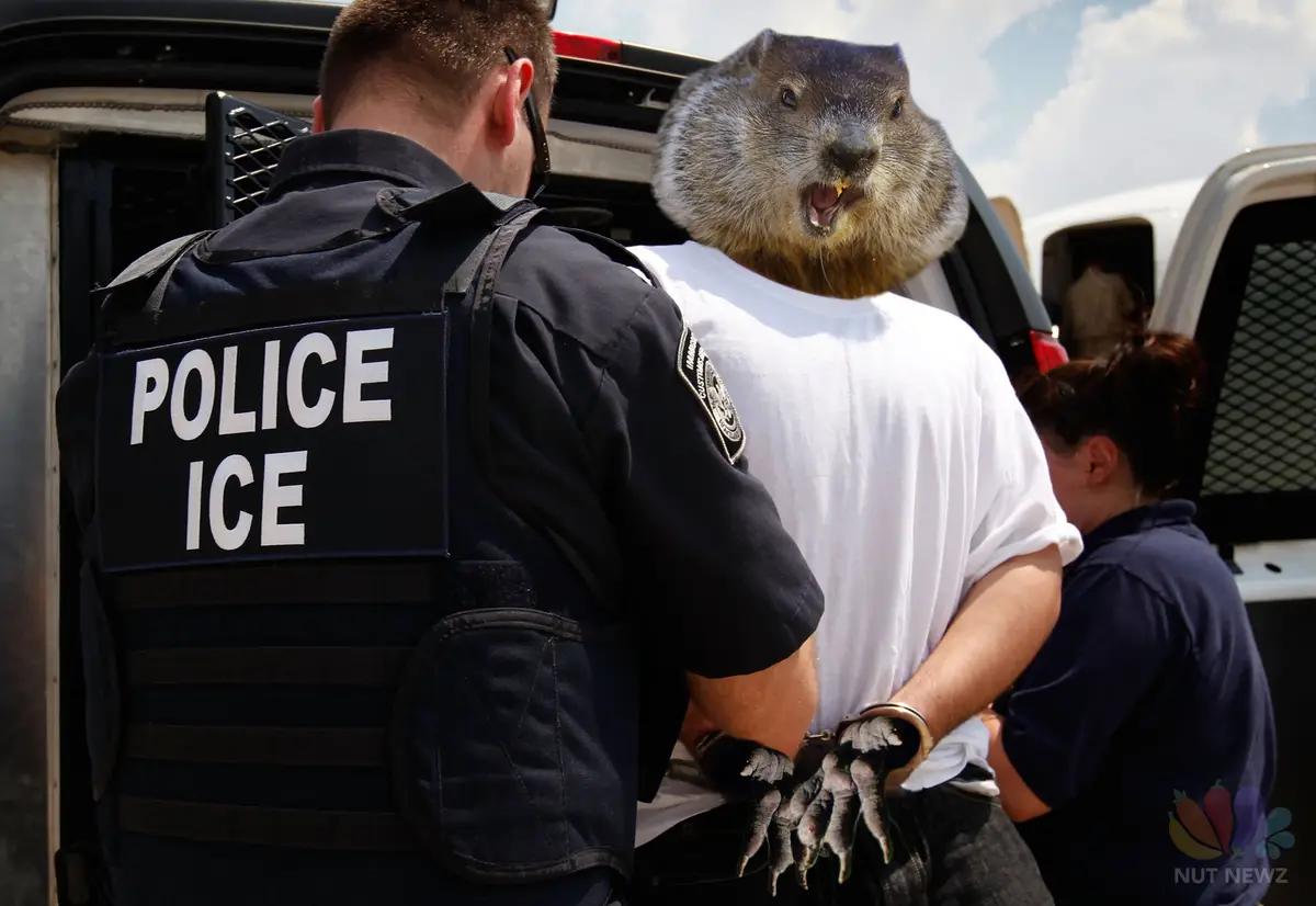 A police officer with 'POLICE ICE' on their vest is arresting a person whose head has been replaced with a groundhog's head…