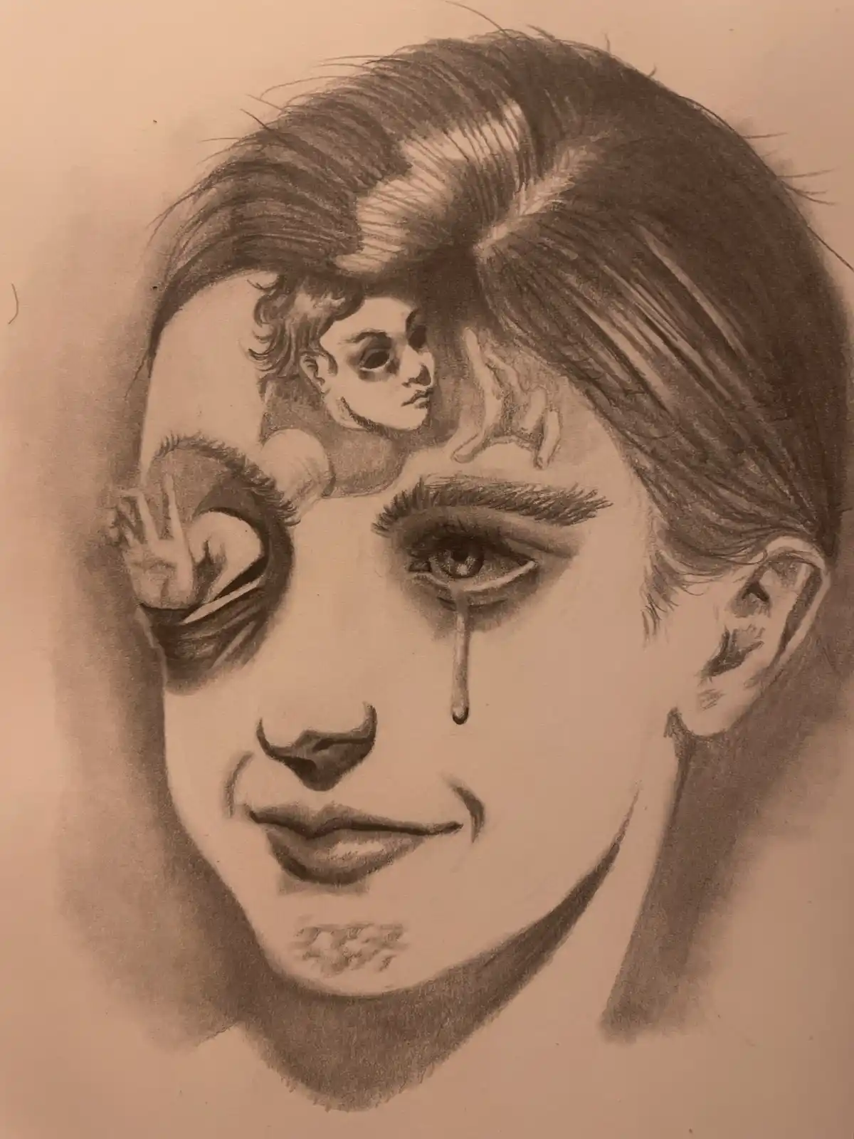 A pencil sketch of a person's face with one eye closed and a tear falling from the other, while a small angelic figure peeks…