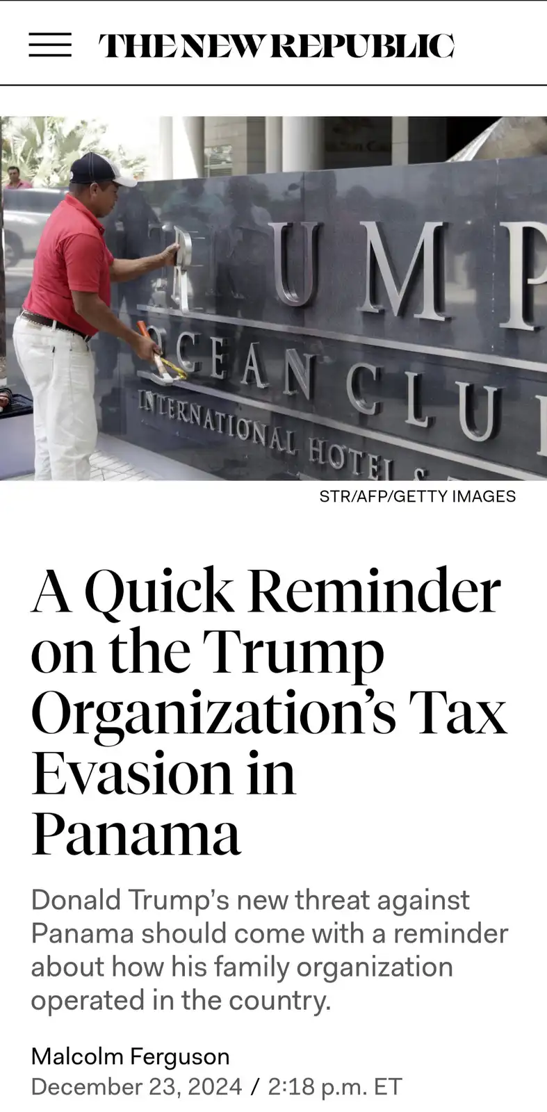 A man in a red shirt and white pants is sanding the letter 'T' off a dark stone sign that reads 'TRUMP OCEAN CLUB…