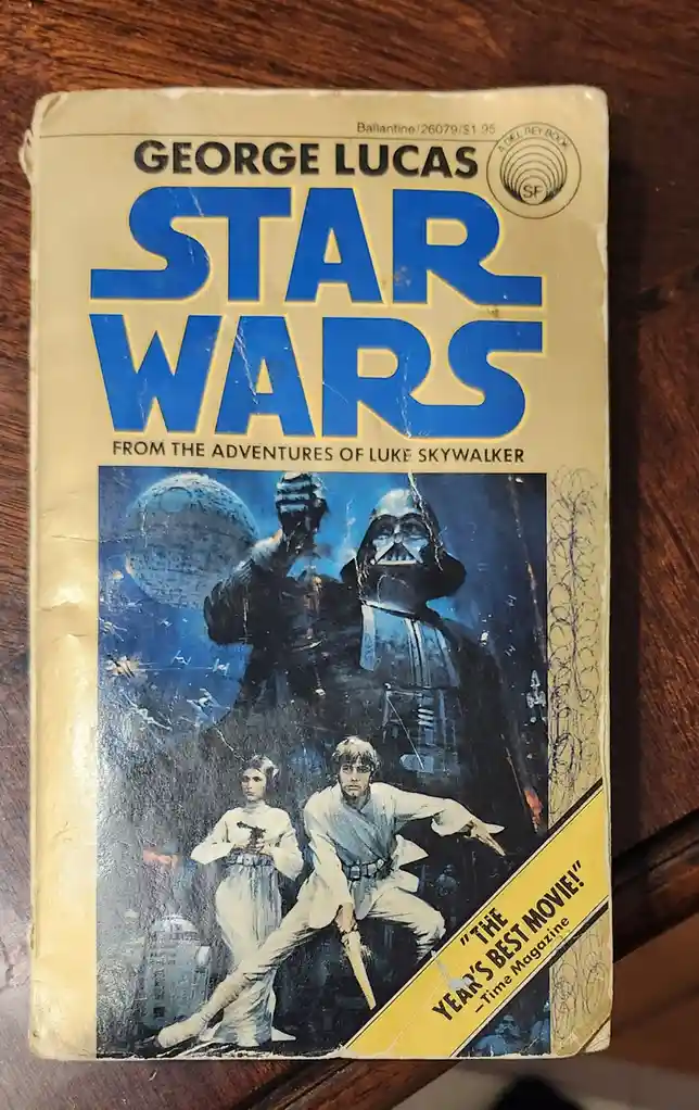 A weathered, yellowed paperback book cover for 'Star Wars: From the Adventures of Luke Skywalker' by George Lucas, featuring…