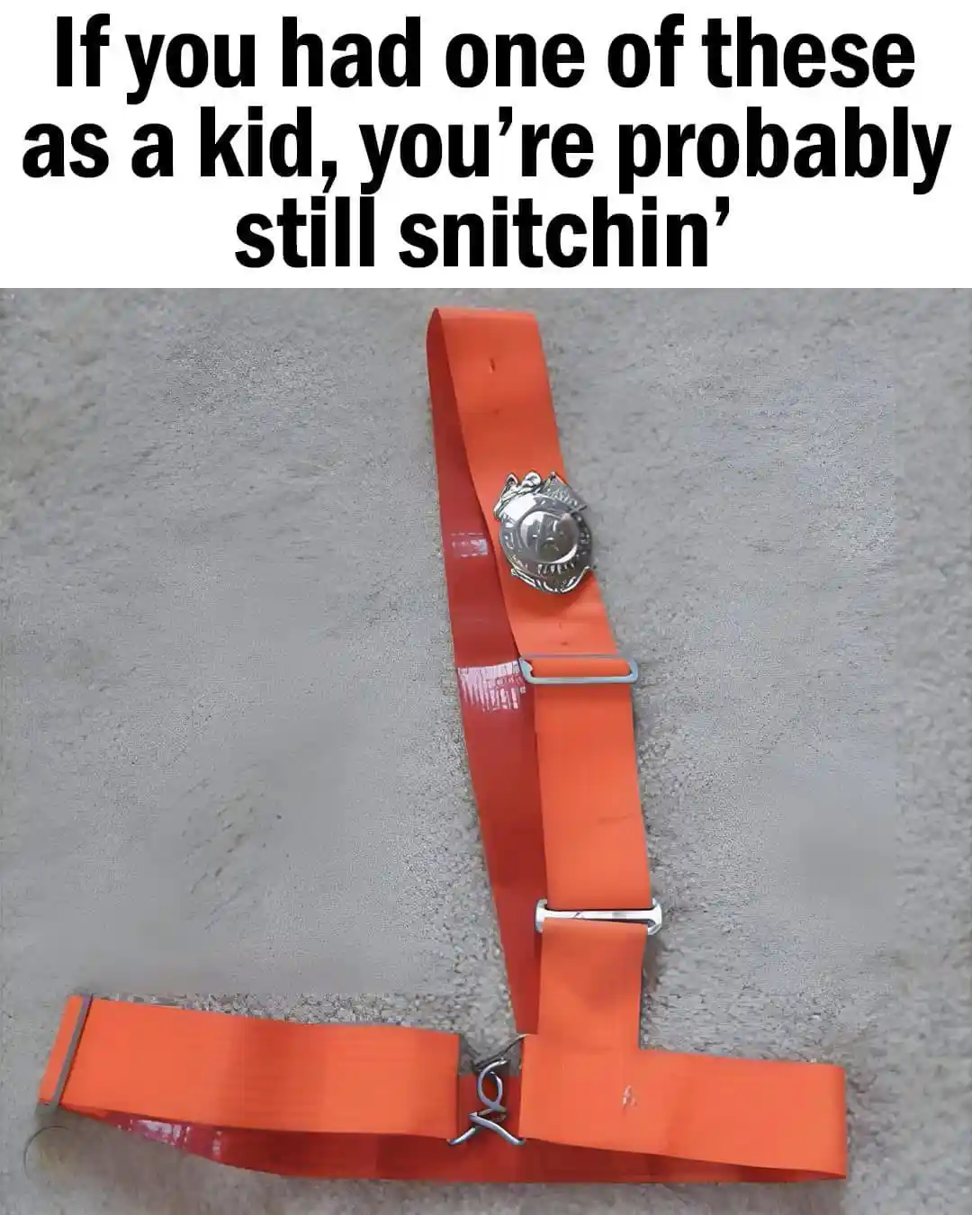 An orange, wide, harness-like belt with metal buckles and a silver police badge attached lies on a gray carpet. The overlaid…