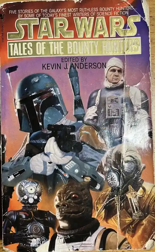 The image shows the cover of a worn, scratched 'Star Wars: Tales of the Bounty Hunters' book edited by Kevin J. Anderson. It…