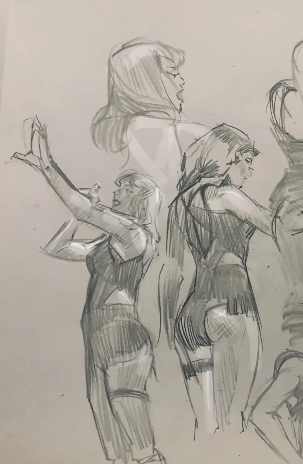 A pencil sketch shows several stylized female characters in dynamic poses, with one character in the foreground holding a…