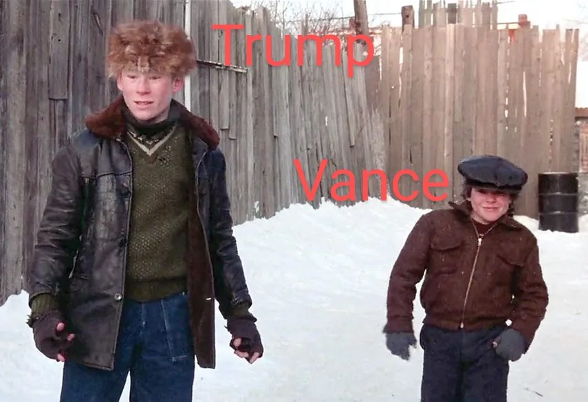 Two young boys stand in a snowy yard in front of a wooden fence. The boy on the left wears a fur hat and leather jacket…