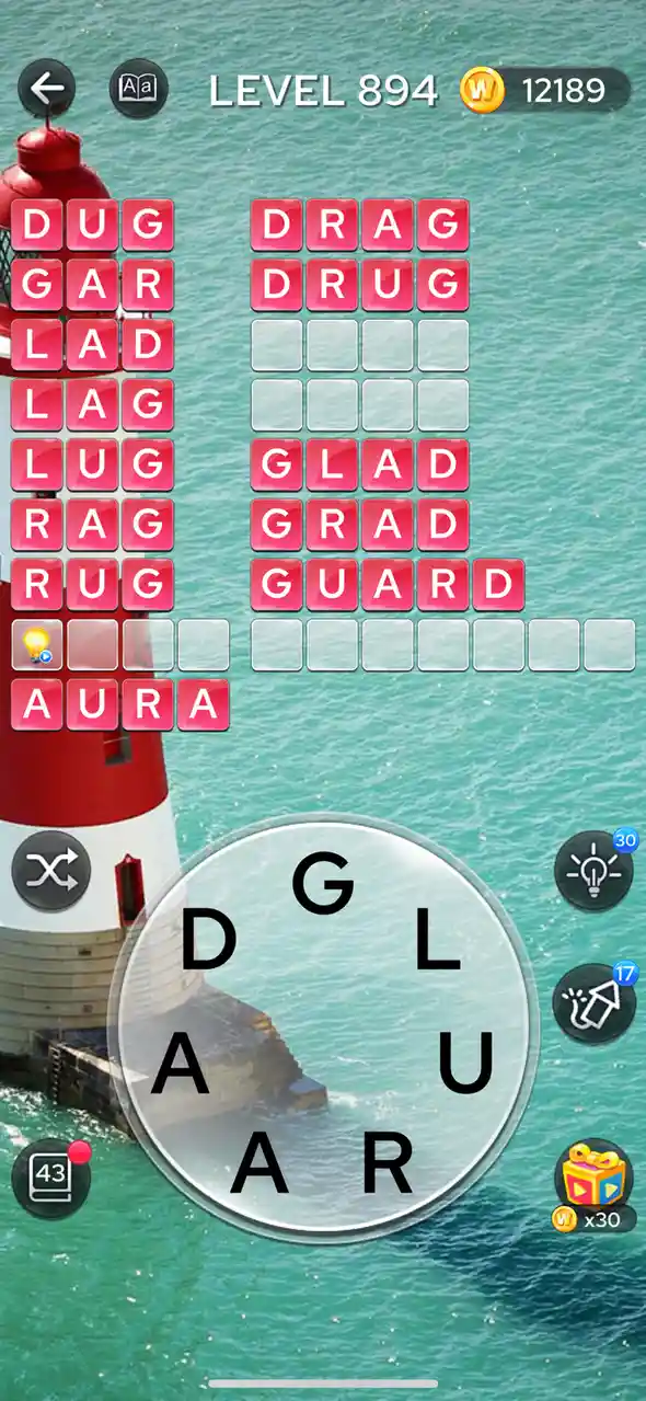 A screenshot from a word puzzle game shows a lighthouse against turquoise water. The game interface displays 'LEVEL 894' and…