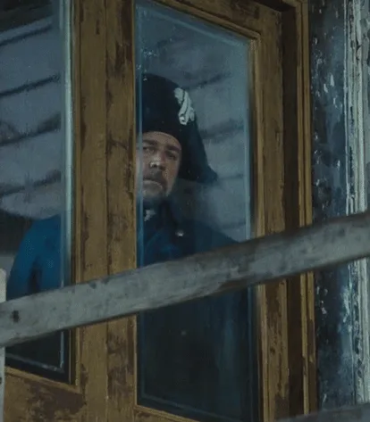 A six-panel grid shows actor Russell Crowe in a blue military uniform and black tricorn hat, looking out from behind a…