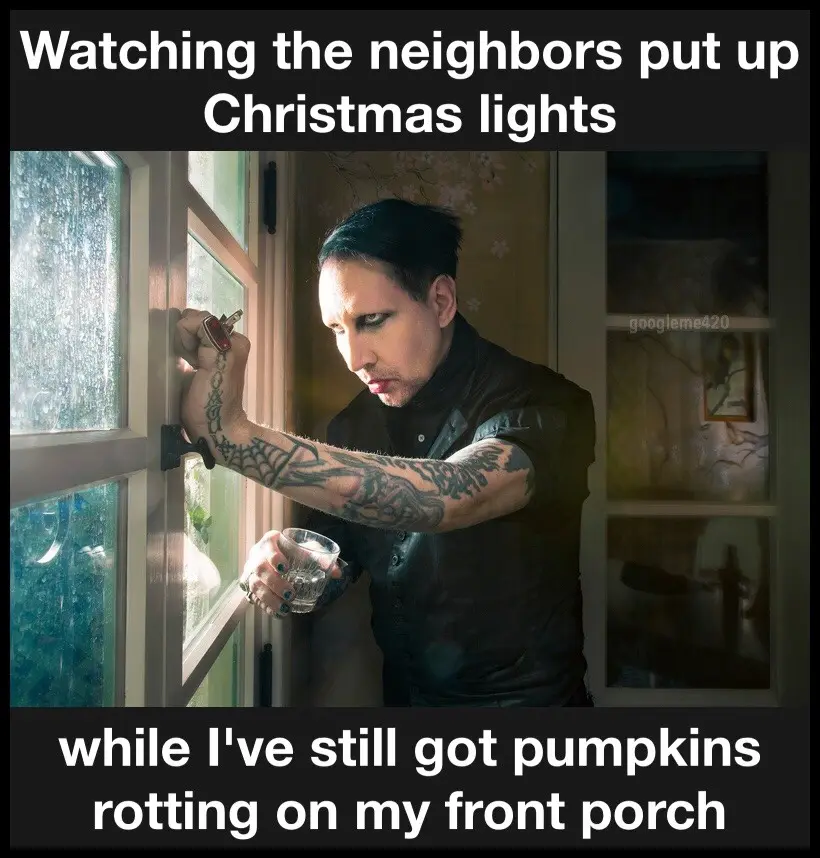 A man with tattoos and dark makeup peers out a window while holding a glass, looking annoyed. The text above reads 'Watching…