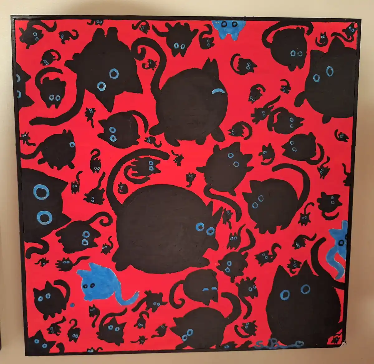 A hand-painted artwork on a red background features numerous black cartoon cats with blue eyes, varying in size and pose…