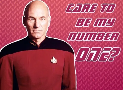 A man in a red Starfleet uniform with a captain's insignia stands against a pink patterned background. The text 'care to be…