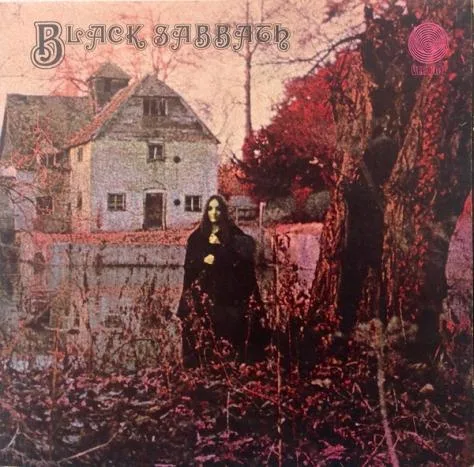The image is the iconic album cover for Black Sabbath's self-titled debut, featuring a dark, gothic scene with a cloaked…