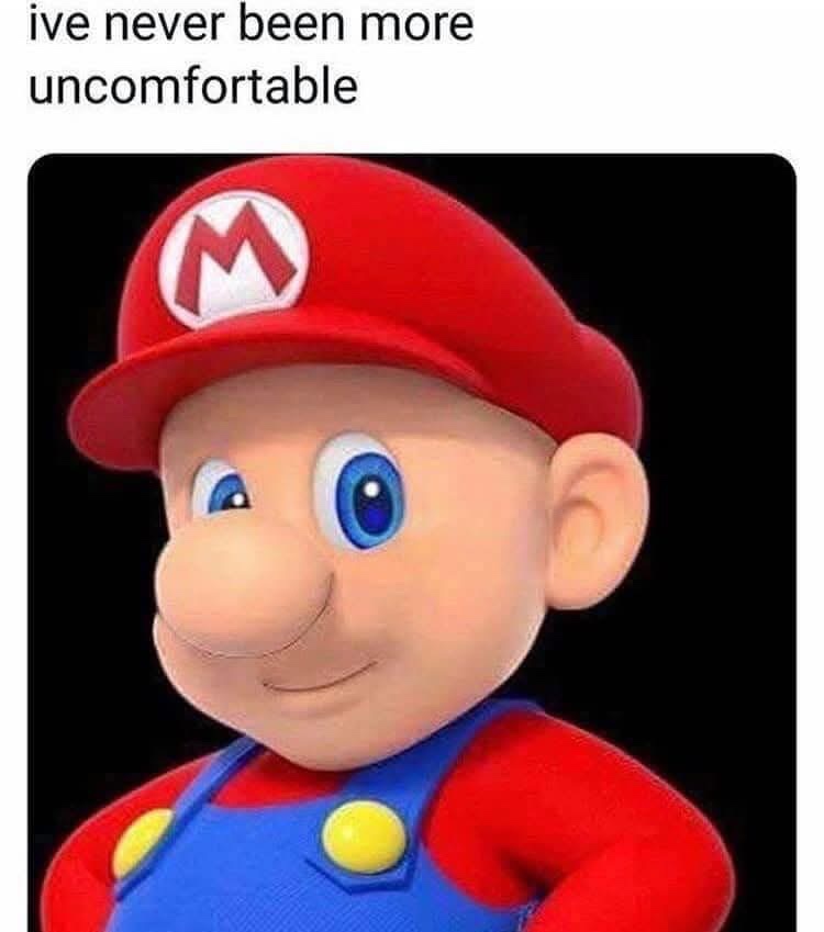 A close-up image of the video game character Mario, wearing his iconic red cap with a white 'M' logo, blue overalls with…