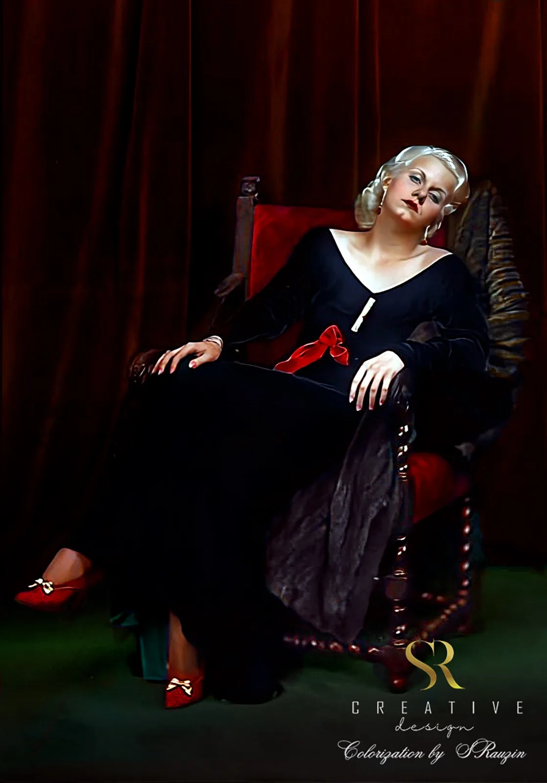 a woman with blonde hair sits in a red velvet chair wearing a black dress with a red bow and red shoes, looking upward with…