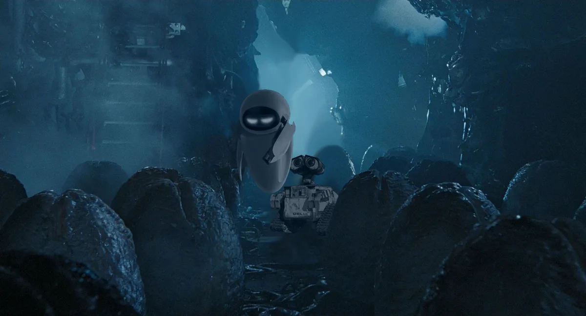 A still from the movie 'WALL-E' shows the robot WALL-E standing in a dark, rocky, and debris-filled environment…