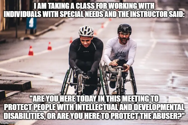 Two men in wheelchairs are shown on a wet street, one in a black helmet and black outfit, the other in a white shirt and…