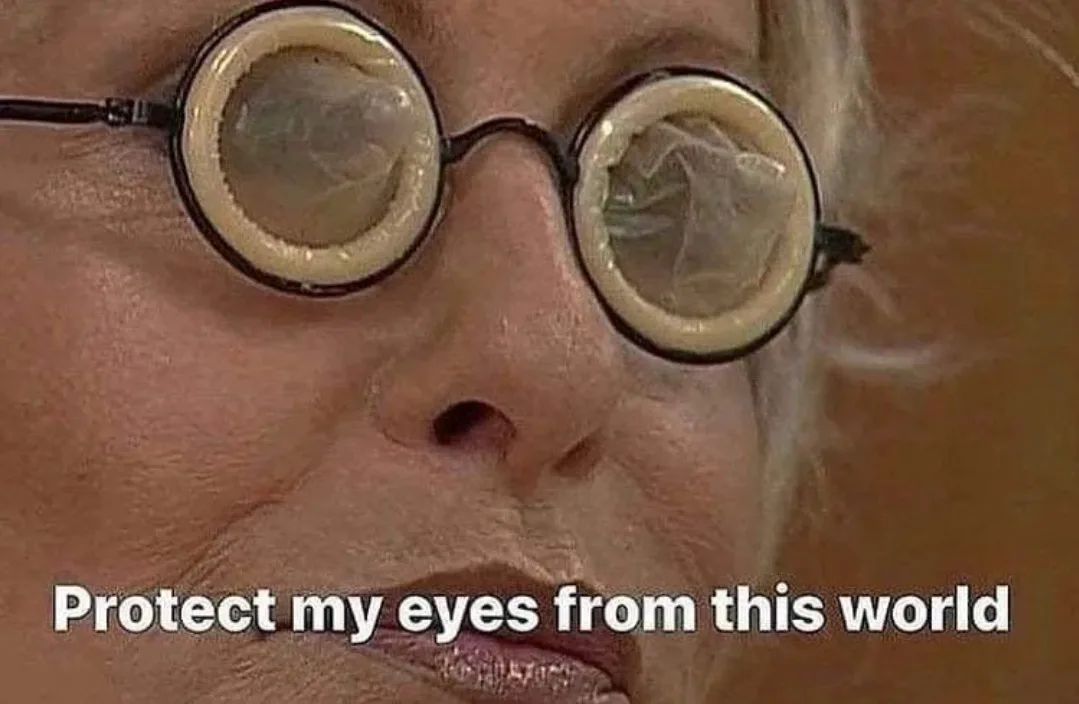 A close-up of an older woman's face, wearing round glasses with clear, wrinkled plastic lenses resembling condoms. The text…