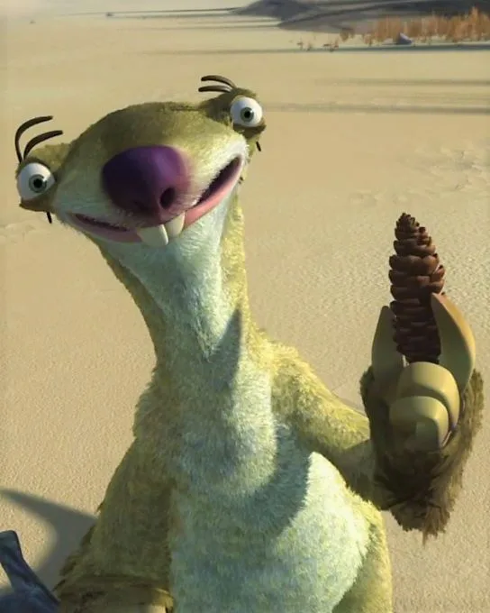 A close-up of the animated sloth character Scrat from 'Ice Age' holding a pinecone in his clawed hand, standing in a…