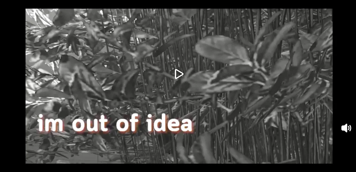 A black-and-white video still shows dense foliage with leaves and stems, overlaid with the text 'im out of idea' in a…
